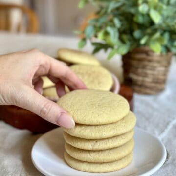 Grabbing a tea cake cookie.