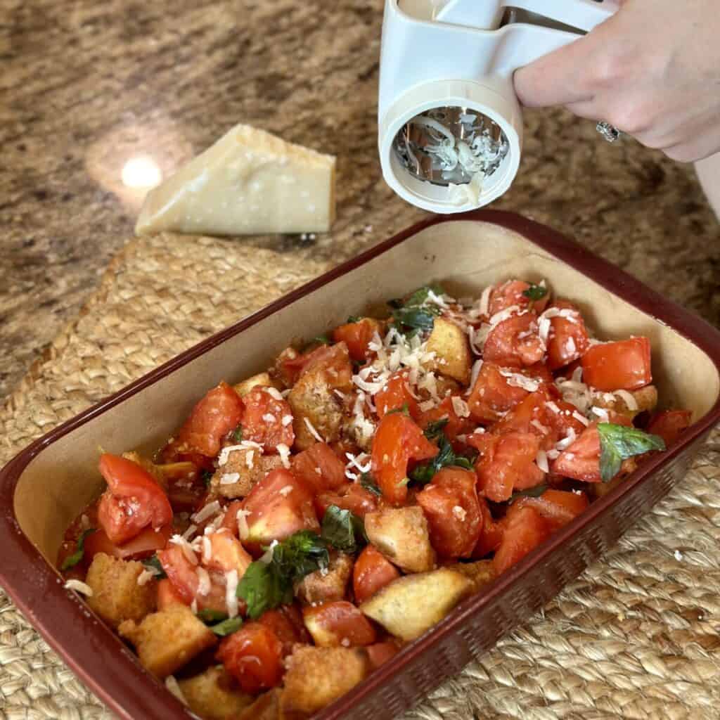 Adding cheese to the top of scalloped tomatoes