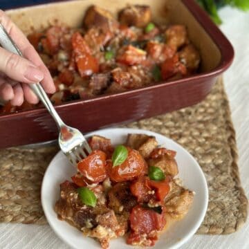 A serving of scalloped tomatoes on a plate.