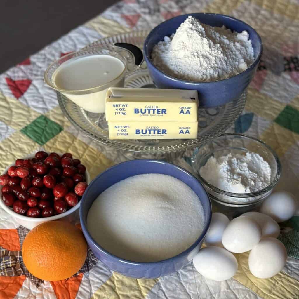 The ingredients to make a cranberry orange pound cake.