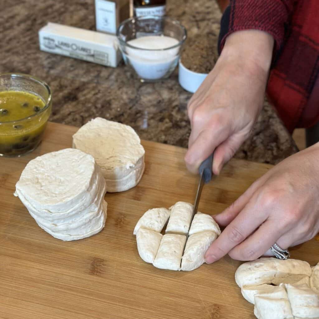 Cutting biscuit dough into cubes.