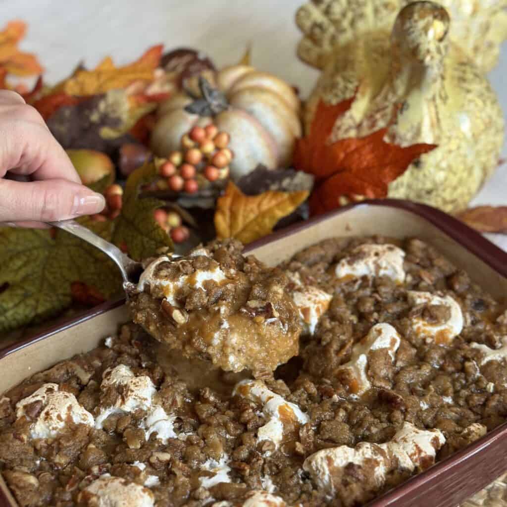 Getting a spoonful of easy sweet potato casserole.