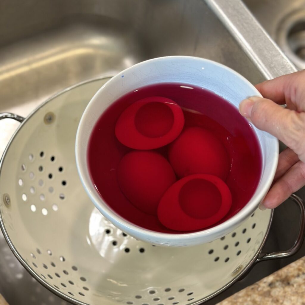 A bowl of egg white in dyed water.