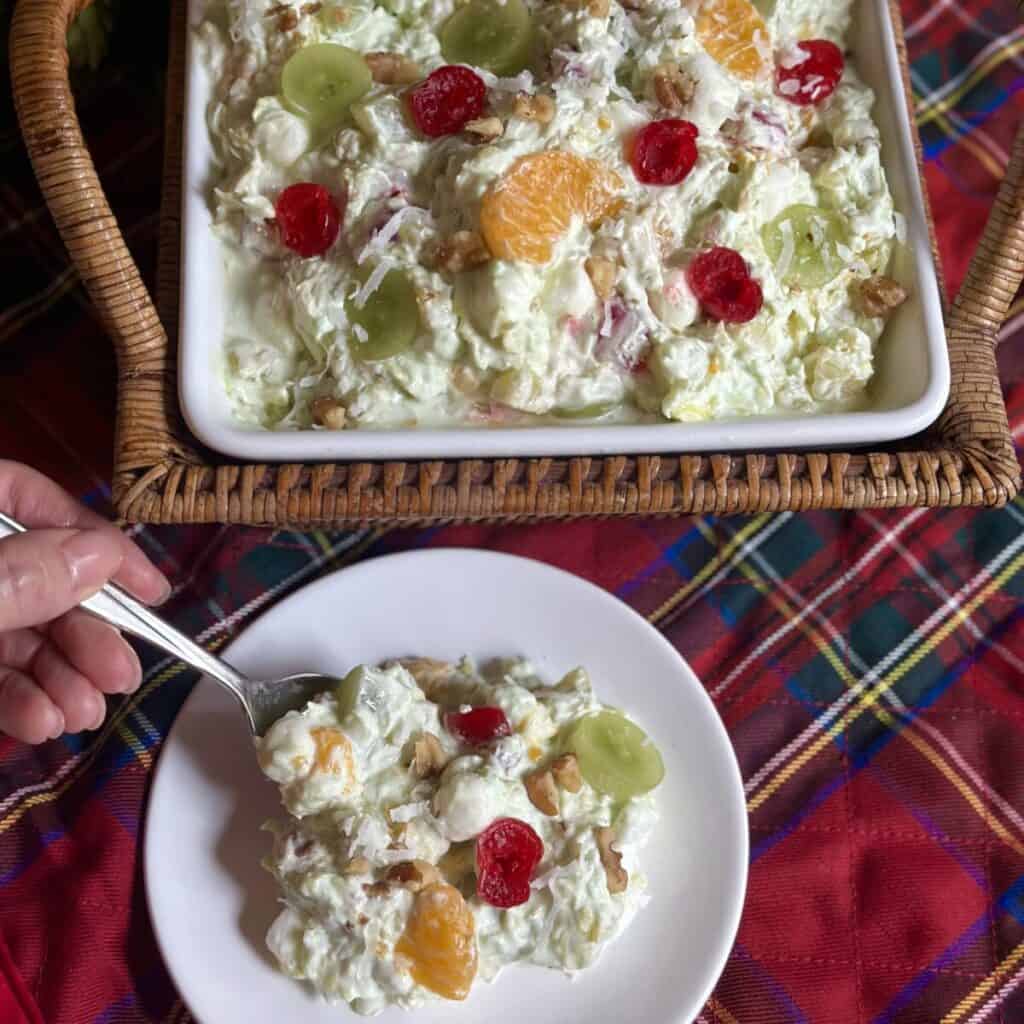 A serving of pistachio ambrosia salad on a plate..